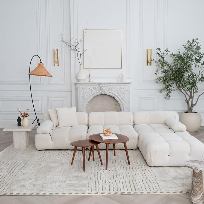 Elegant living room with white sofa and decor.