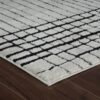 Modern white textured rug on wooden floor
