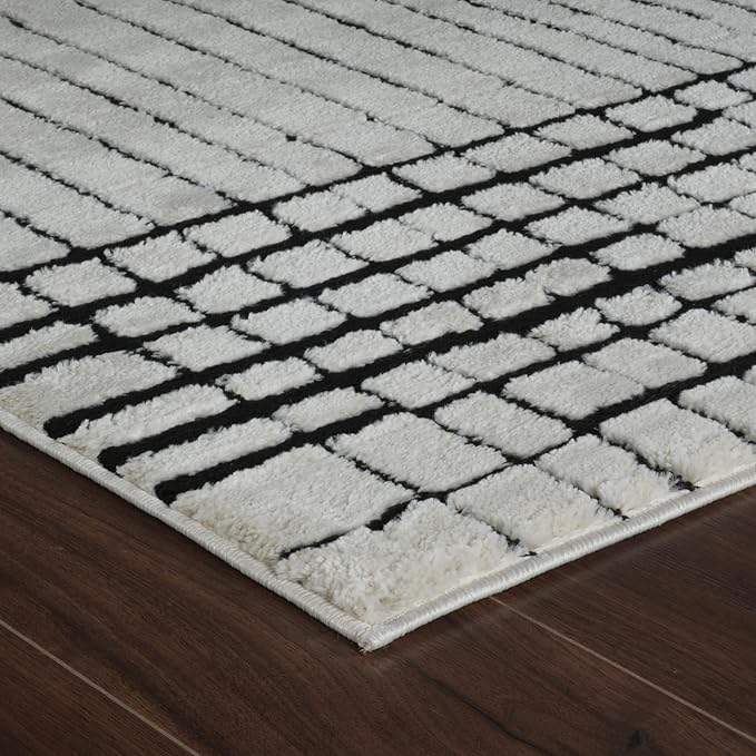 Modern white textured rug on wooden floor