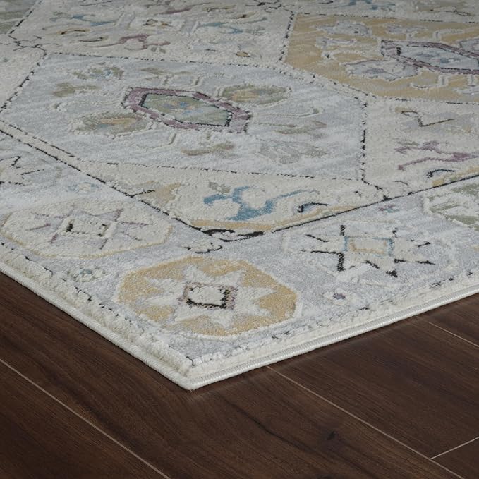 Patterned rug on dark wood floor