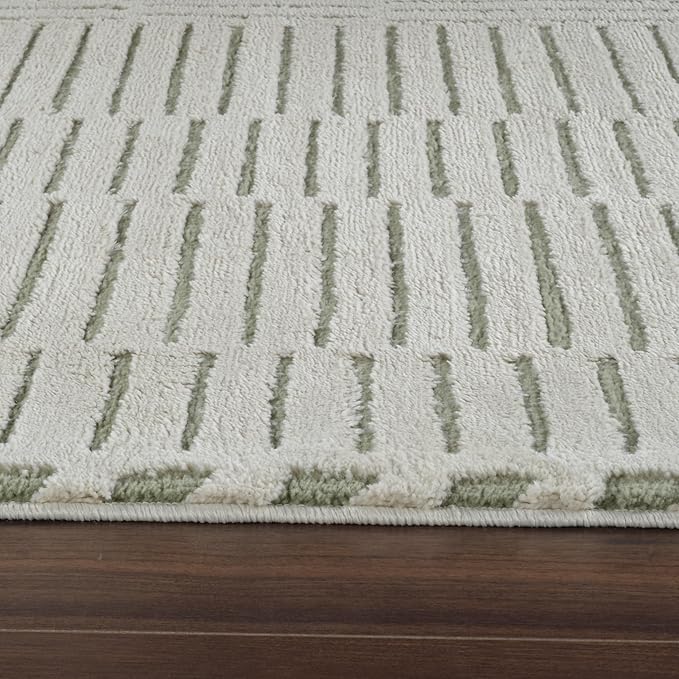 Beige and green textured carpet on wooden floor