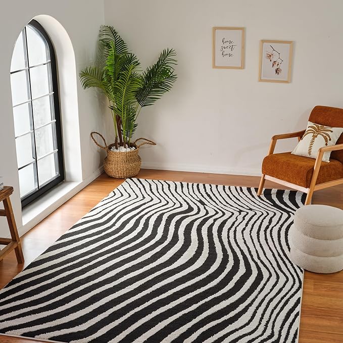 Stylish room with zebra rug and modern decor.