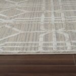 Patterned rug on wooden floor