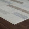 Modern striped rug on wooden floor
