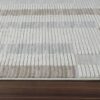 Striped textured rug on wooden floor
