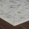 Patterned beige rug on wooden floor.