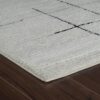 White textured rug on wooden floor