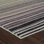 Striped rug on wooden floor