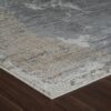 Gray and beige textured rug on wooden floor.