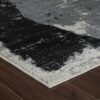 Close-up of textured black and white rug edge.