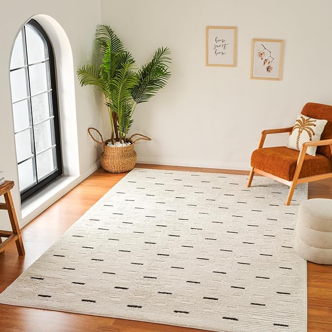 Cozy living room with geometric rug and armchair.
