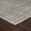 Geometric patterned area rug on wooden floor