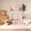 Cozy nursery with toys and decorative items.