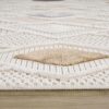 Textured beige and white geometric area rug
