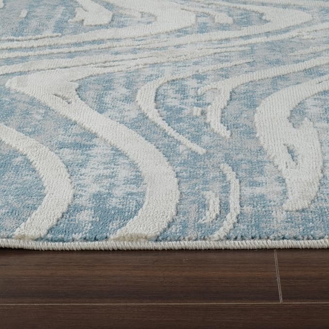 Blue and white wavy pattern rug on wood floor.