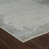 Beige abstract area rug on dark wood floor