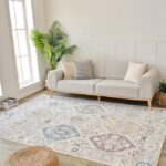 Modern living room with sofa and patterned rug.