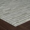 Striped area rug on hardwood floor