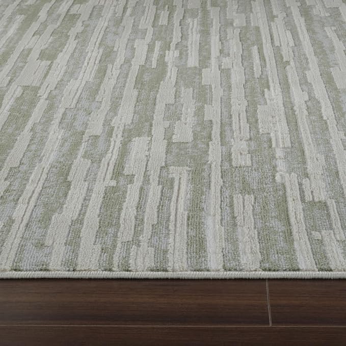 Modern beige rug on dark wood floor