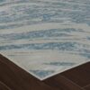 Modern textured rug on wooden floor