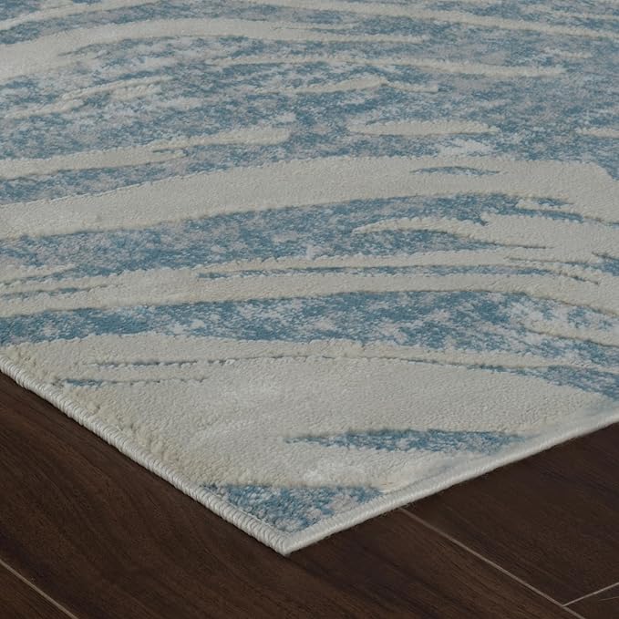 Modern textured rug on wooden floor