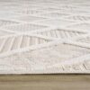 Textured beige carpet with geometric patterns.