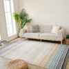 Modern living room with sofa and striped rug