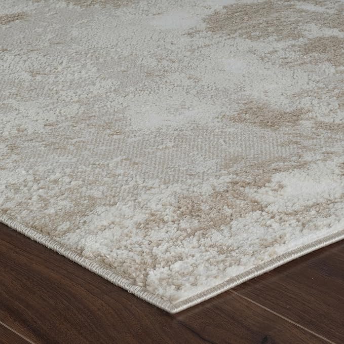 Textured beige and white rug on hardwood floor.
