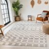 Cozy living room with checkered rug and armchair.