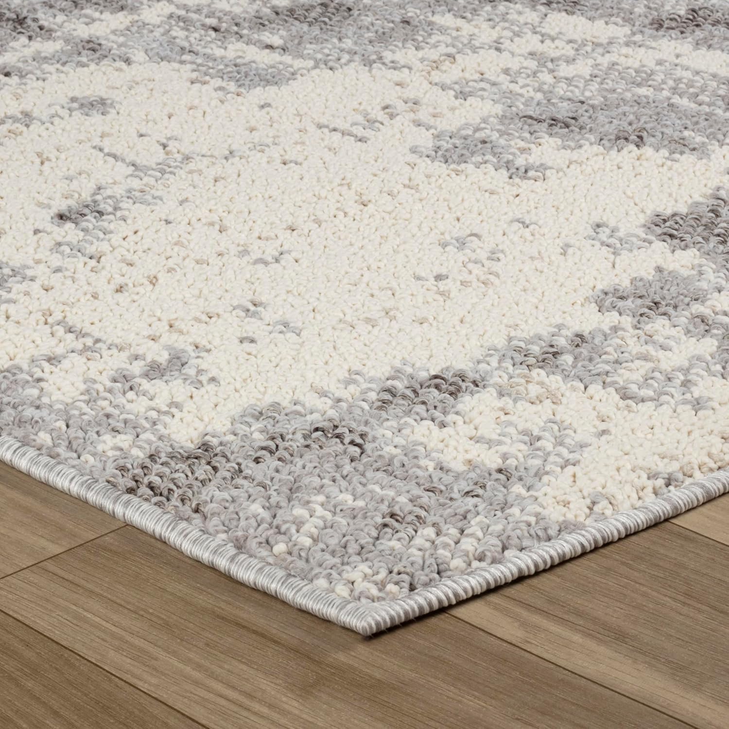 Gray and white textured area rug on floor