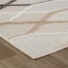Beige geometric pattern rug on wooden floor.