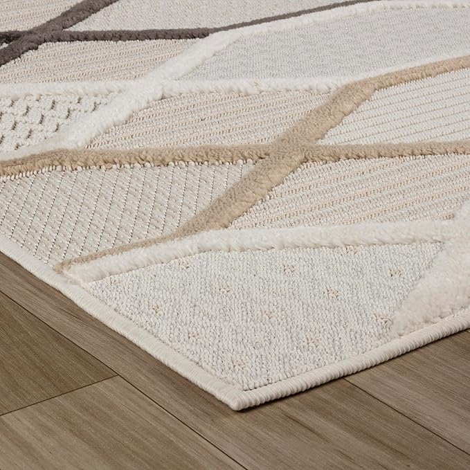 Beige geometric pattern rug on wooden floor.