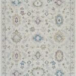 Vintage floral pattern rug in soft pastel colors.