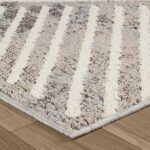 Textured gray and white striped area rug on floor.