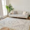 Modern living room with sofa and patterned rug.