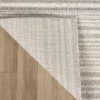 Gray textured rug on wooden floor