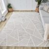 Geometric-patterned rug in modern living room setting.