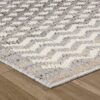 Gray and white zigzag patterned rug on wood floor.