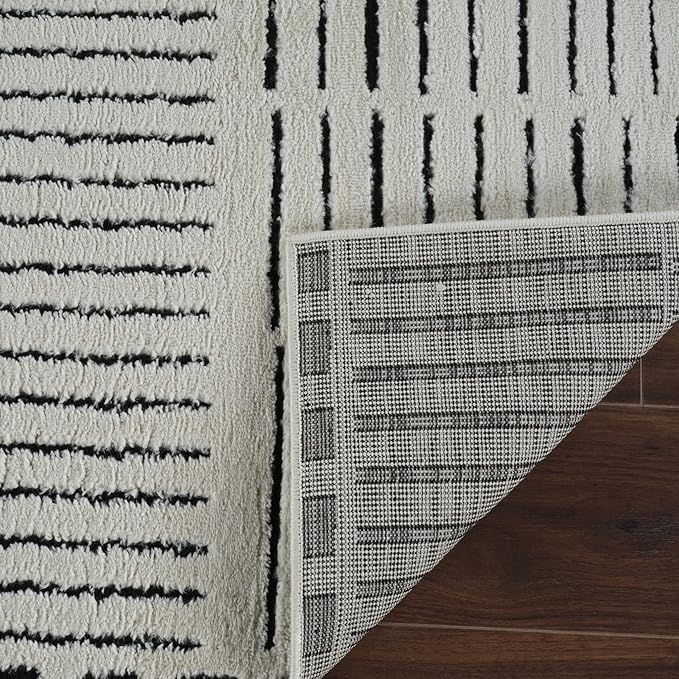 Black and white rug with corner flipped