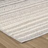 Textured beige area rug on wooden floor.