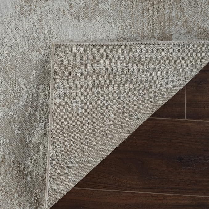 Corner of carpet lifted on wooden floor