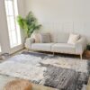 Modern living room with sofa and abstract rug