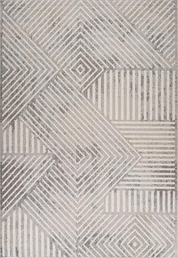 Geometric pattern rug with gray and white stripes.