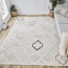 Modern geometric beige and white area rug in room