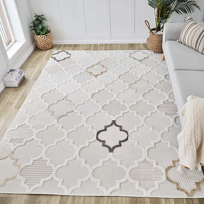 Modern geometric beige and white area rug in room