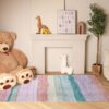 Cozy kids' room with toys and colorful rug.
