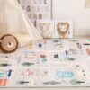 Children's play area with animal illustrations and mat.