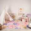 Colorful children's room with teepee and play area.