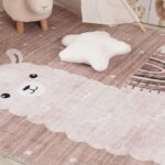 Nursery rug with sheep and star pillow.