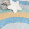 Star pillow and pastel rainbow rug